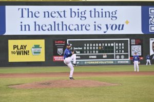 Scott Dominates as Revs Win Late for Fifth Straight Victory